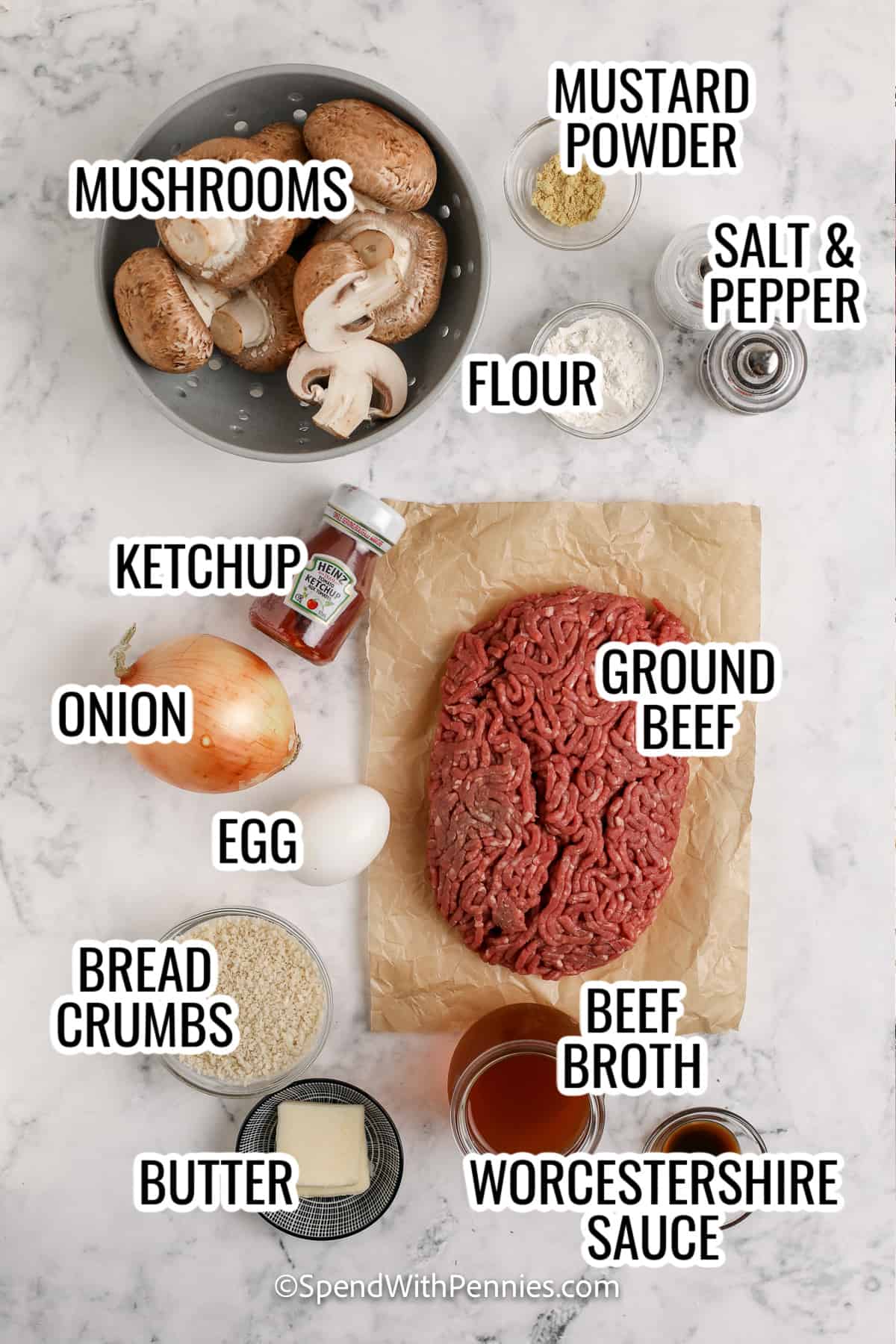 ingredients assembled to make mushroom salisbury steak, including mushroom, ground beef, onion, egg, bread crumbs, butter, ketchup, beef broth, and worcestershire sauce