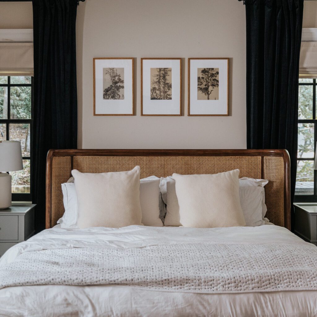 Three Framebridge framed tree pictures above a bed