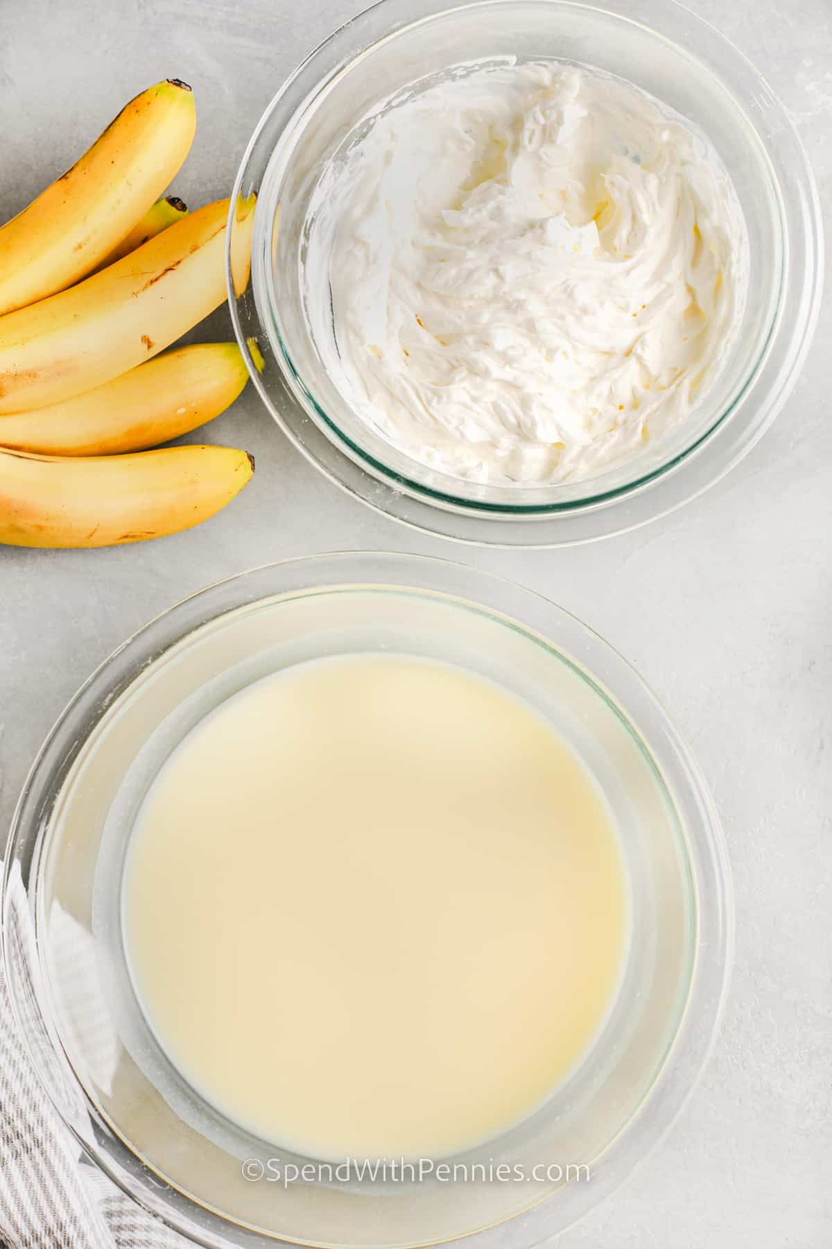 ingredients for banana pudding cheesecake in glass bowls