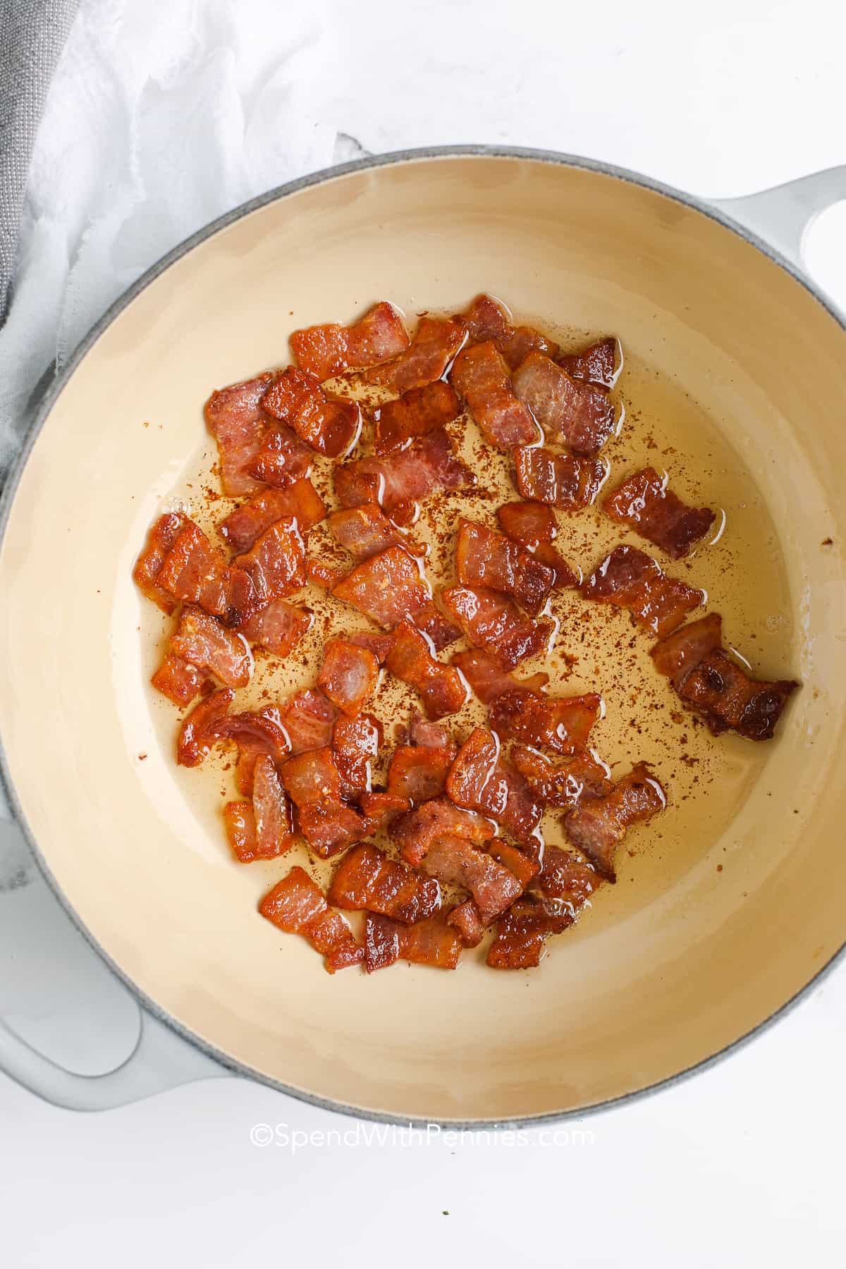 Bacon being cooked in a pan