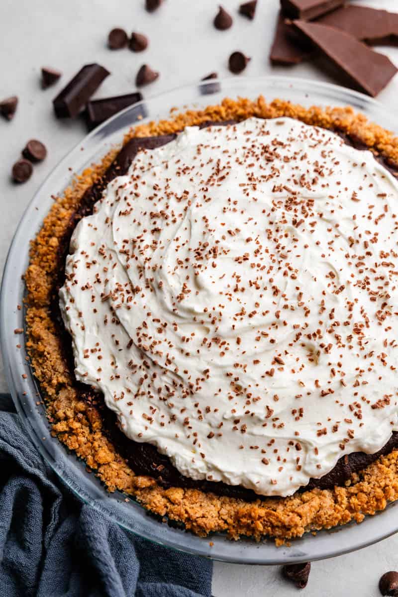 homemade chocolate cream pie in pie pan on table