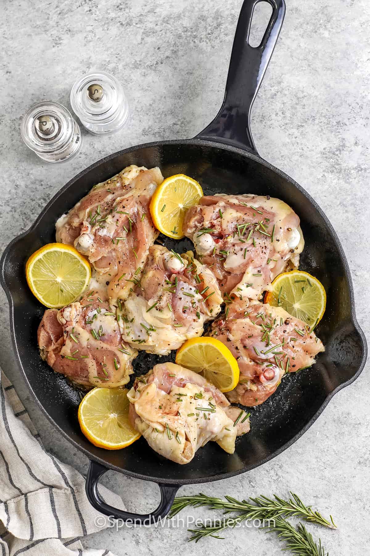 adding ingredients to skillet to make Skillet Chicken Thighs