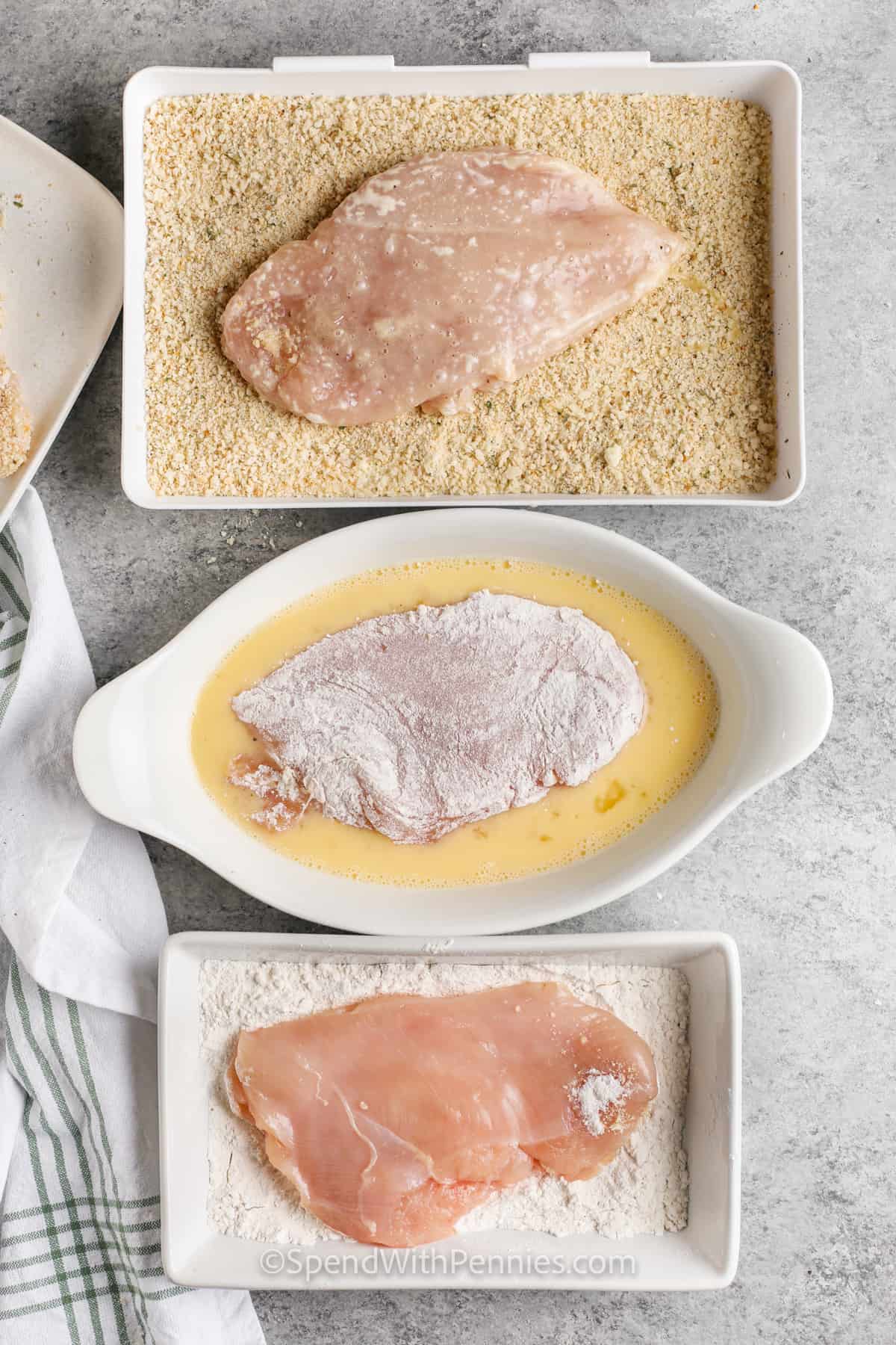 breading chicken to make Easy Chicken Parmesan