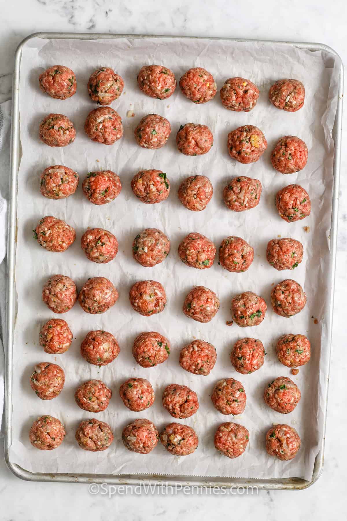 meatballs on a sheet pan before cooking to make Easy Meatball Recipe