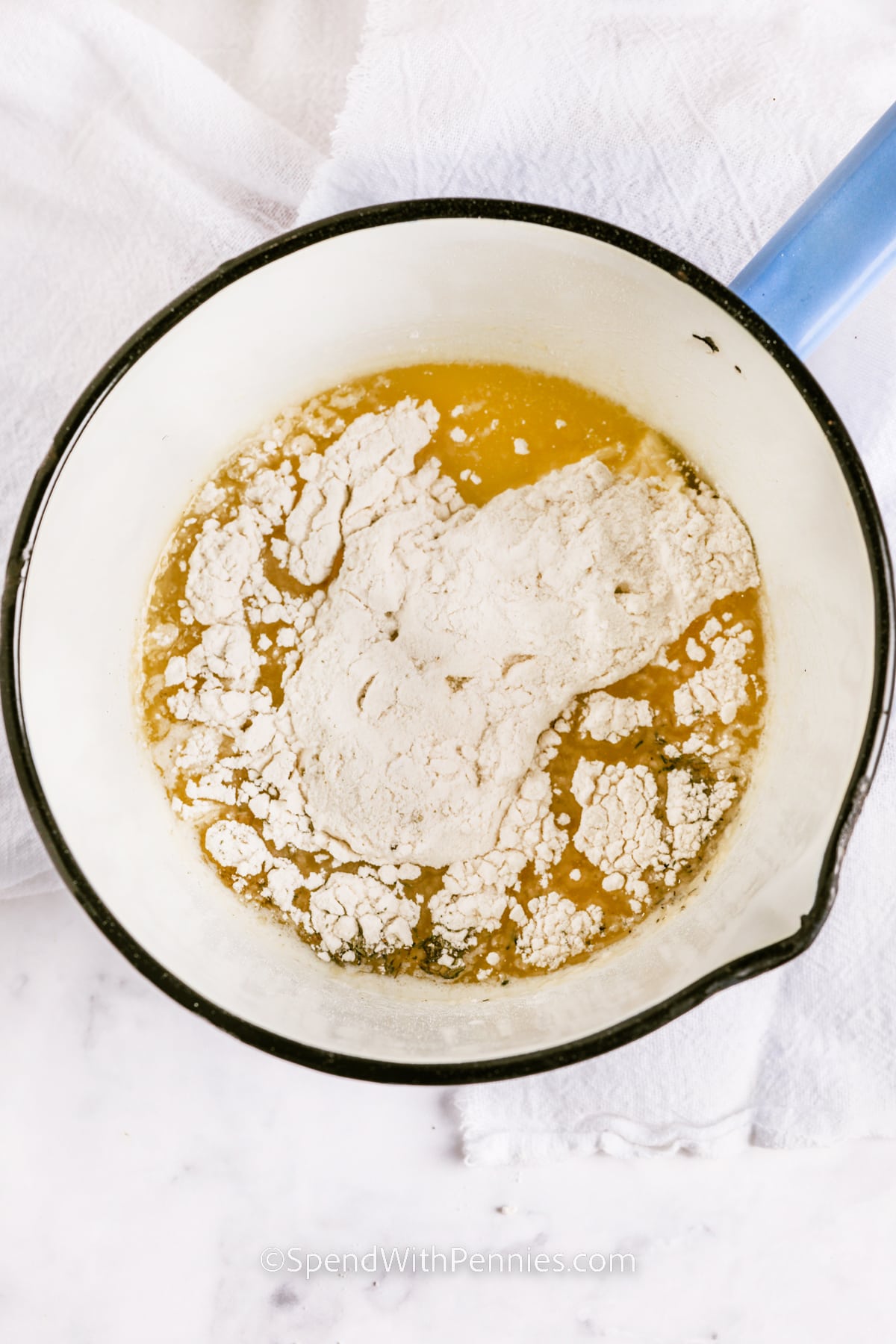 adding flour to pan to make Giblet Gravy