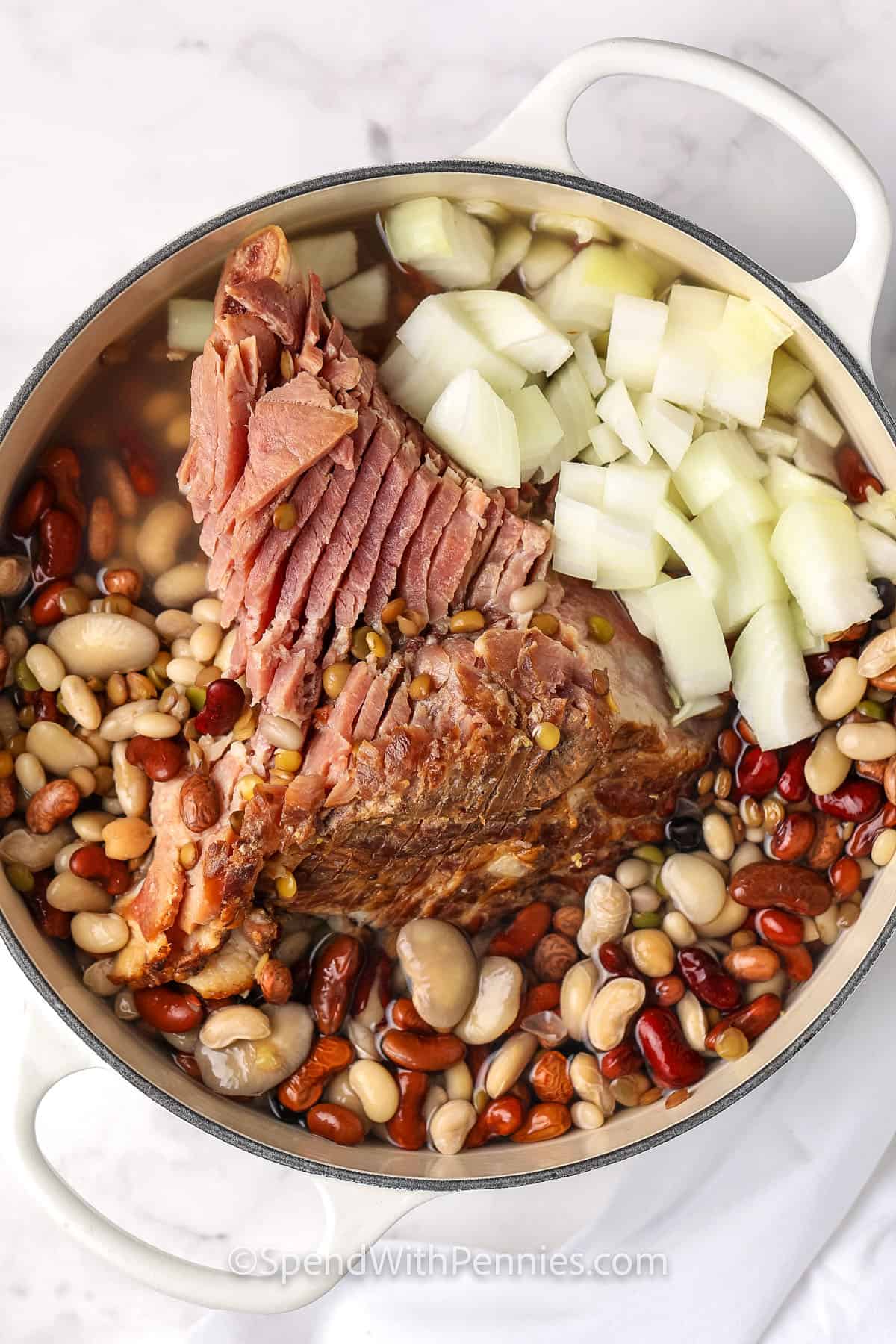 ham and other ingredients in a pot for ham and bean soup