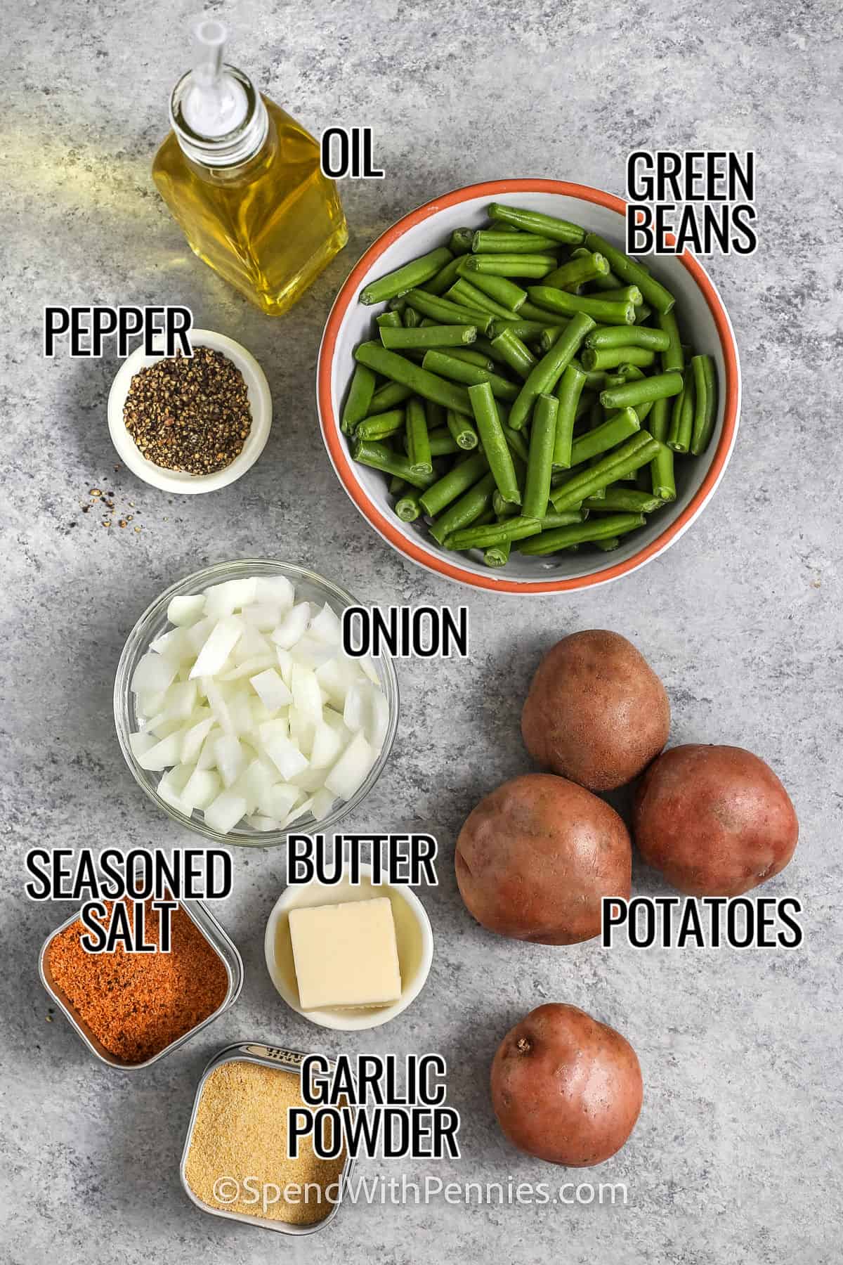 green beans , oil , onion , potatoes , butter , garlic powder , seasoned salt and pepper with labels to make Green Beans and Potatoes