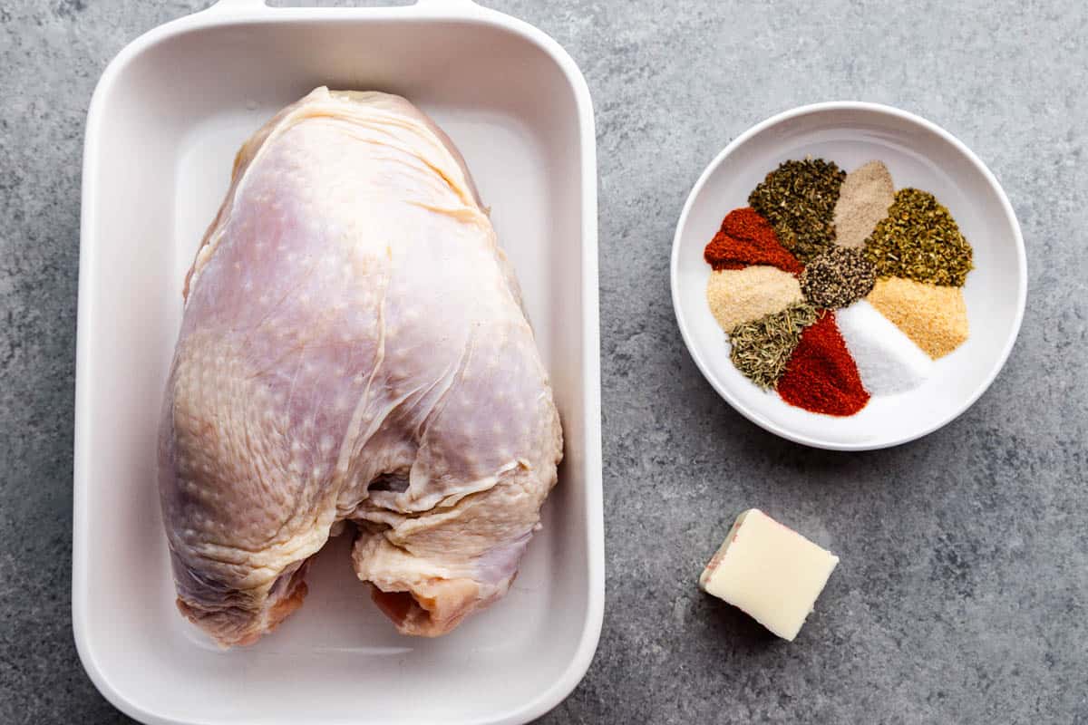 An overhead view of the ingredients needed to make a cajun roasted turkey breast.