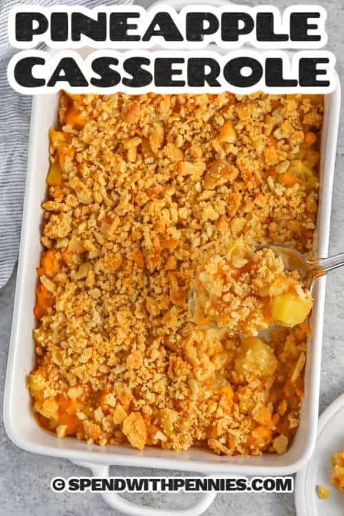 cheesy baked Pineapple Casserole in the dish with a title