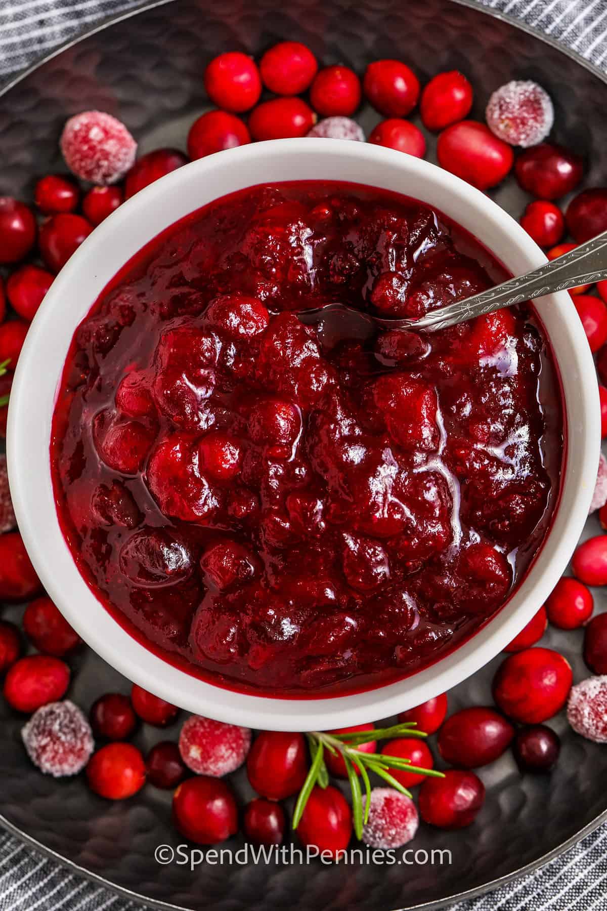 bowl of Quick Citrus Cranberry Sauce with cranberries on a plate