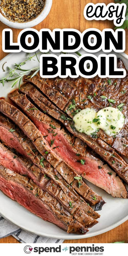 sliced London Broil on a plate with melted butter on top and writing