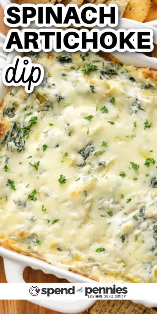 cheesy Spinach Artichoke Dip in the dish with a title