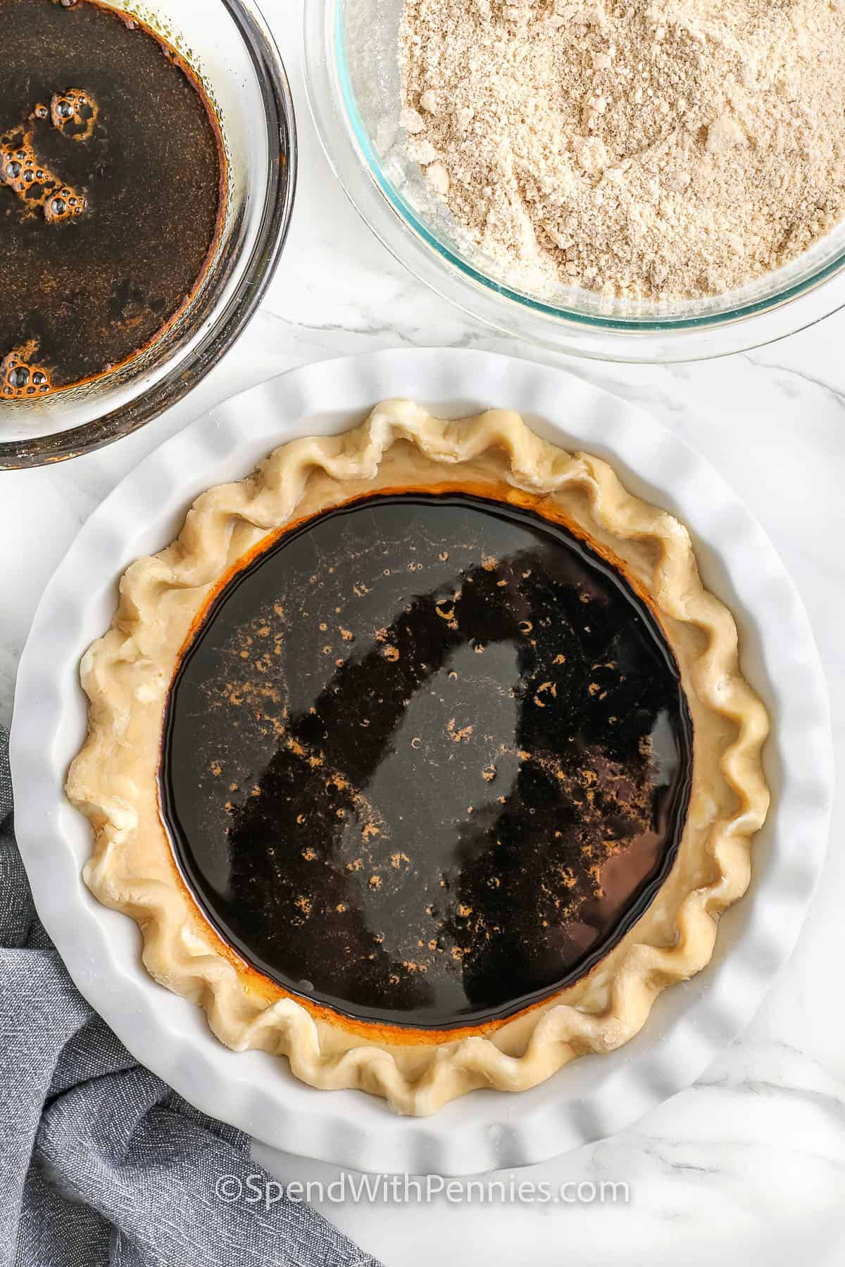 adding filling to pie shell to make Shoofly Pie