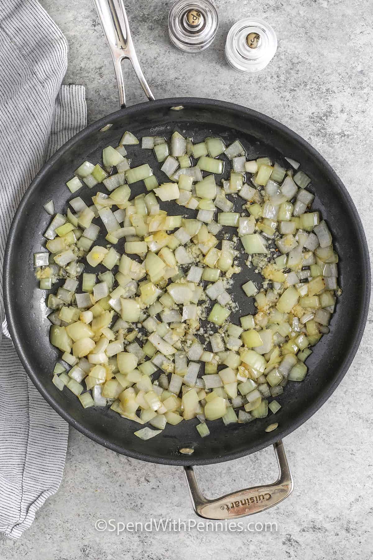 cooking onions and garlic to make Slow Cooker Short Ribs