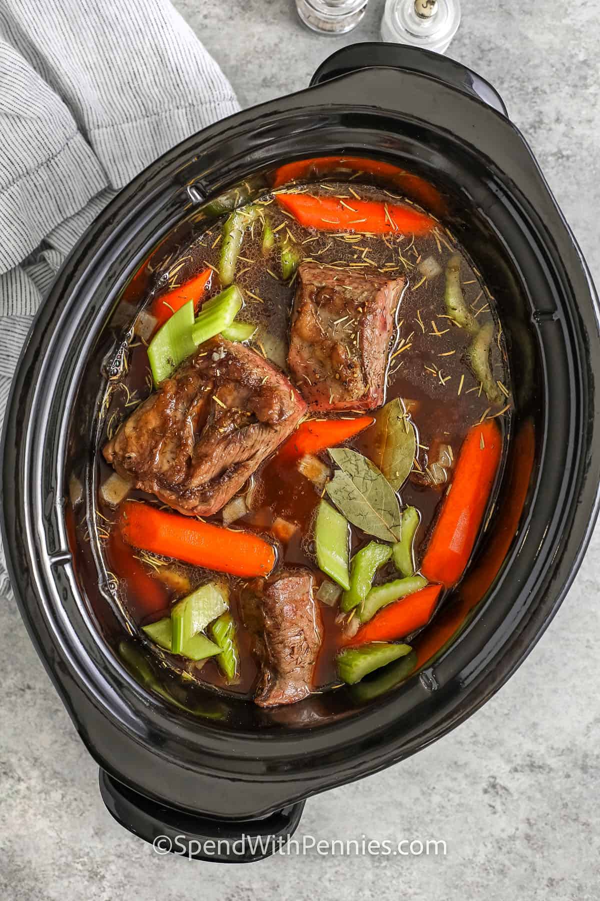 adding liquids to pot to make Slow Cooker Short Ribs