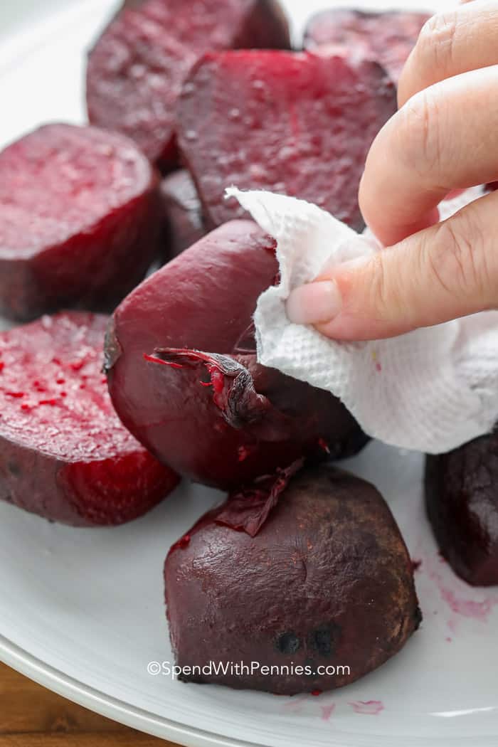 Peeling beets with a paper towel