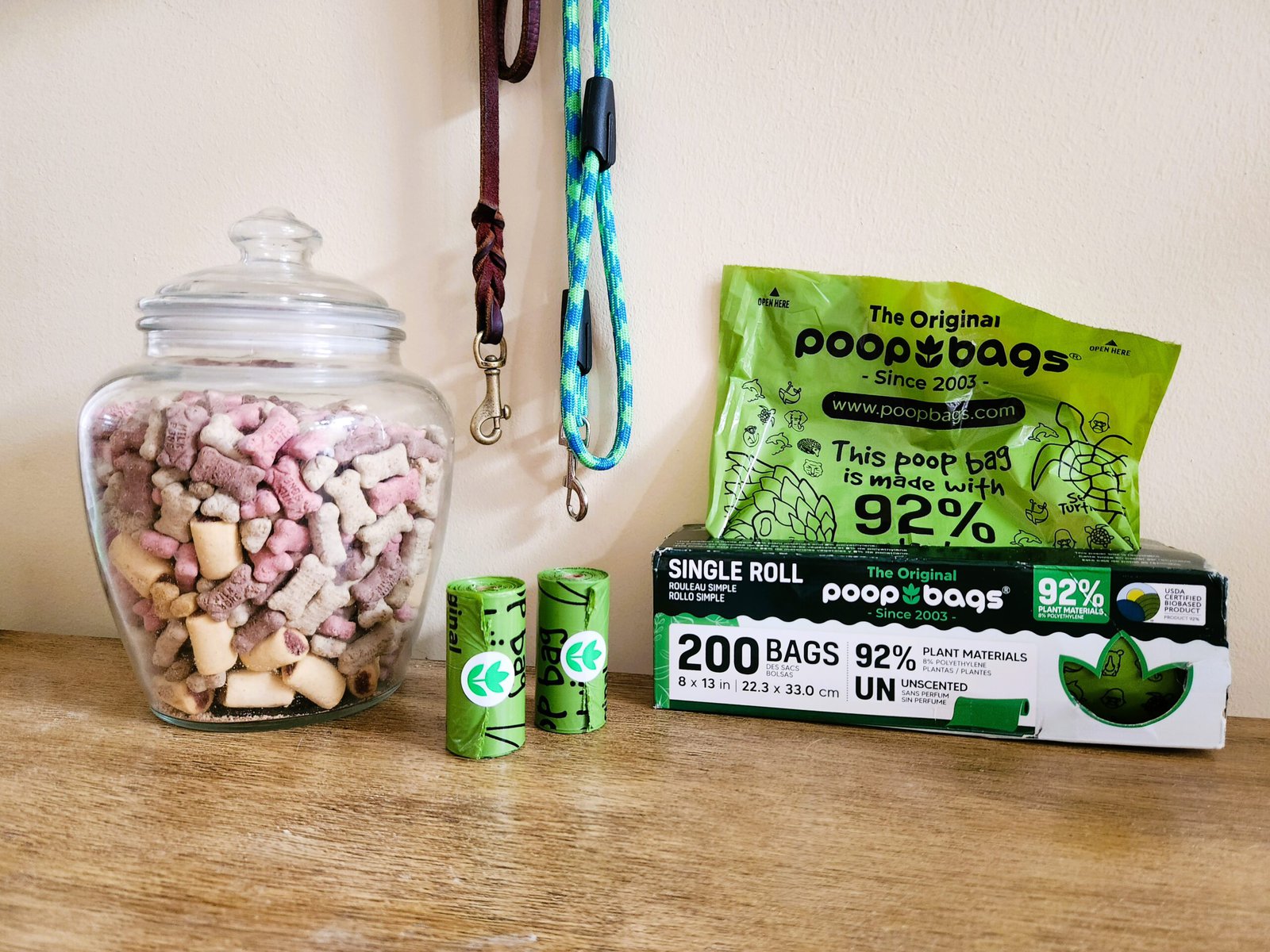 The Original Poop Bags Review - poops bags with a bag of treats and leashes