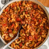 pot full of American Goulash with a spoon