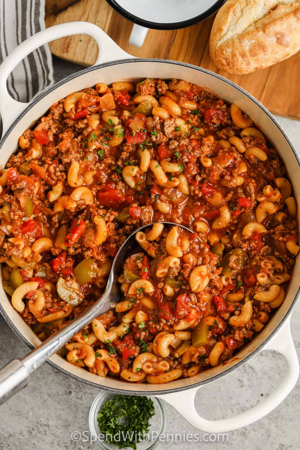 american goulash in a pot with a spoon