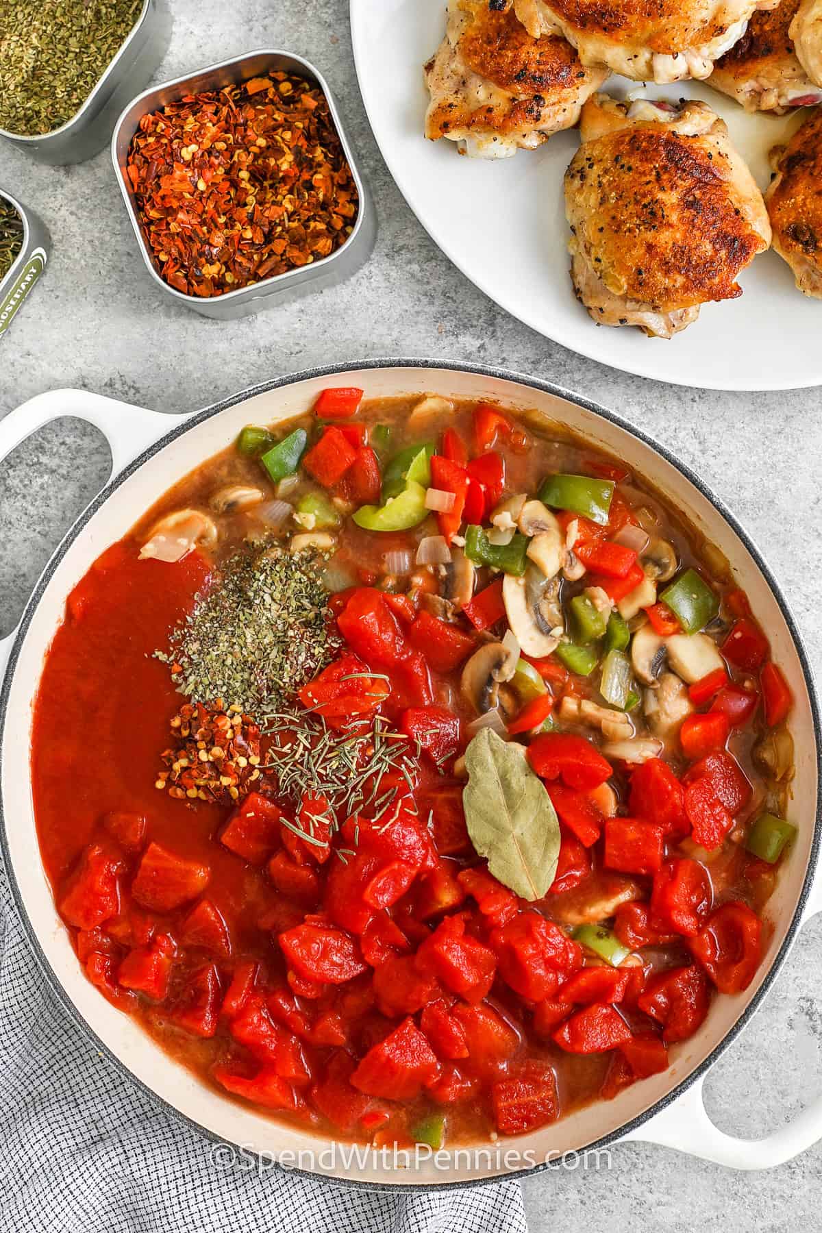 adding ingredients together to make Chicken Cacciatore