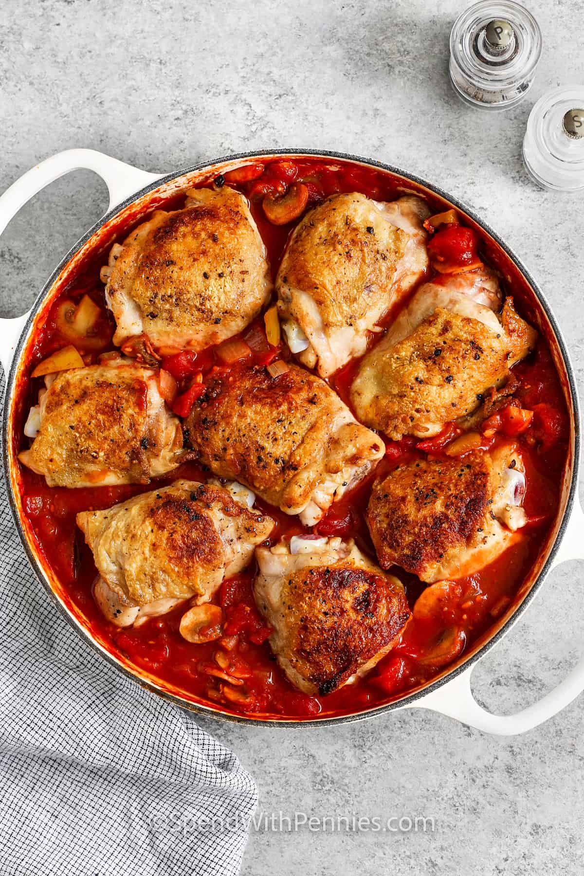 adding chicken to sauce to make Chicken Cacciatore