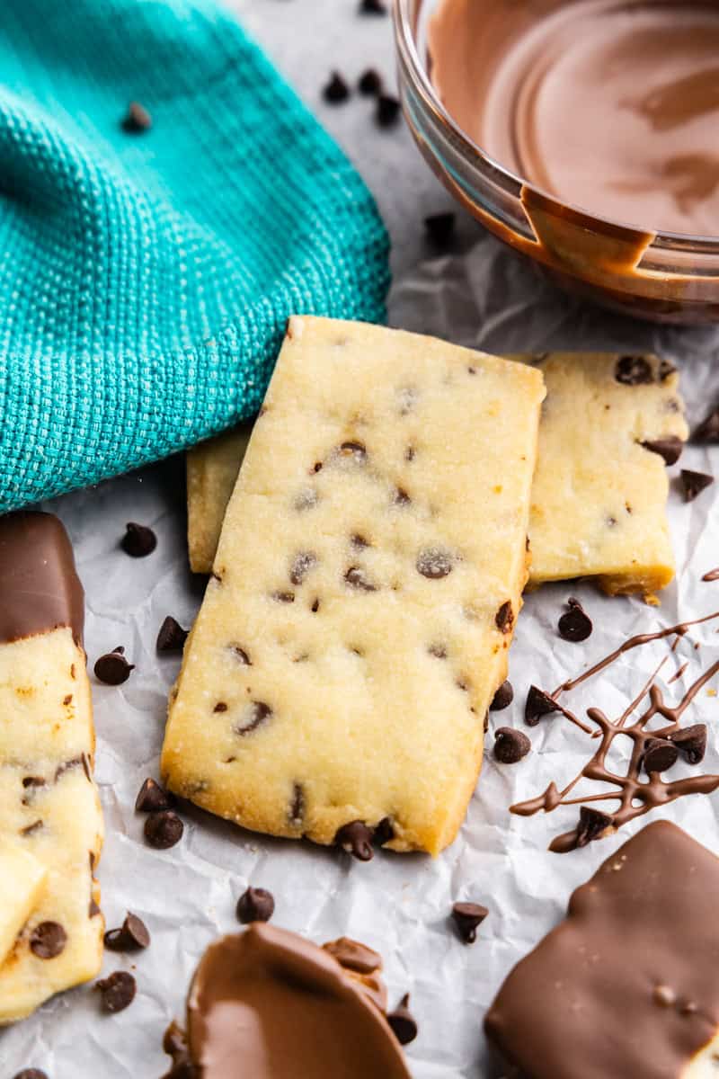 chocolate chip shortbread cookies on a table with blue napkin