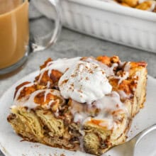 slice of Cinnamon Roll French Toast Casserole with whipped cream