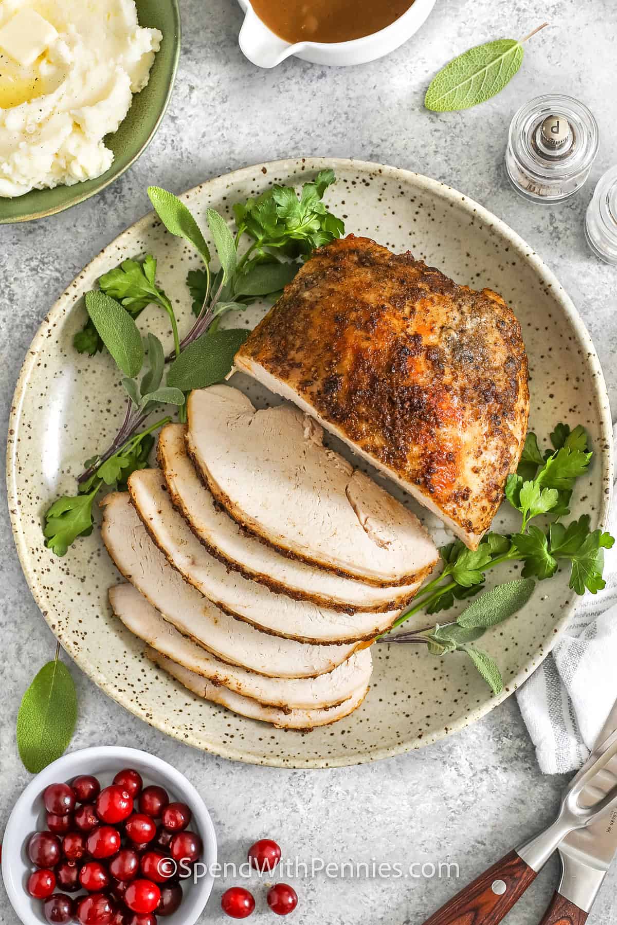 sliced turkey breast on a plate for Crockpot Turkey Breast