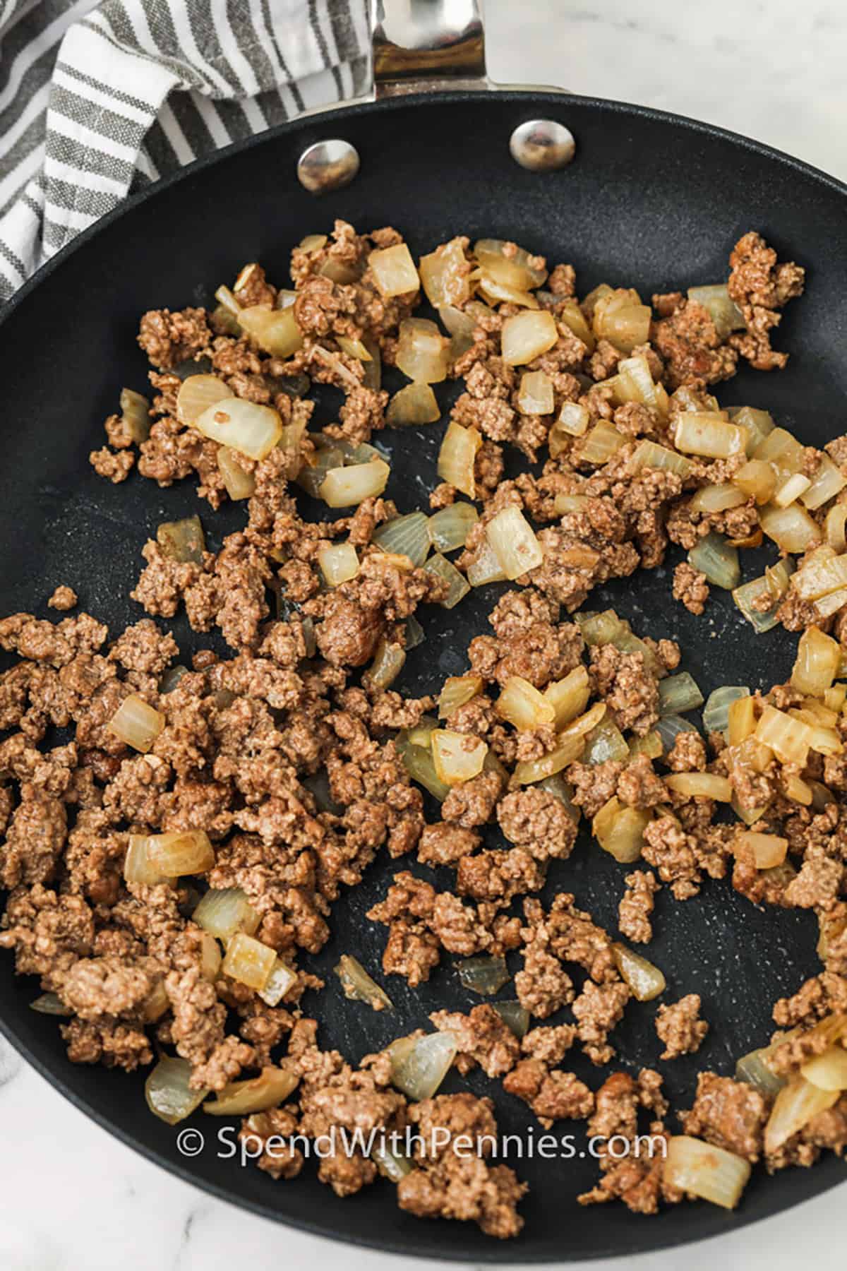 cooking beef and onions to make Sesame Ground Beef Stir Fry