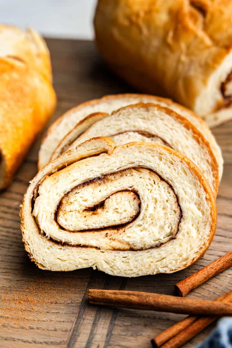 side view of slices of cinnamon swirl bread on cutting board