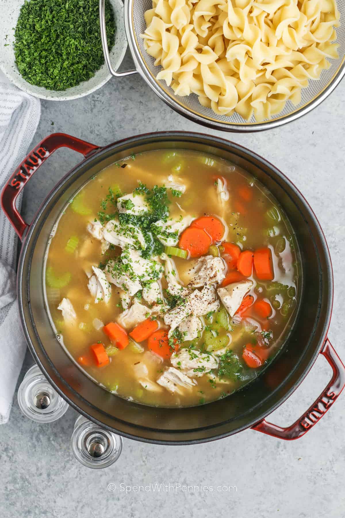 turkey added to vegetables in a pot of broth