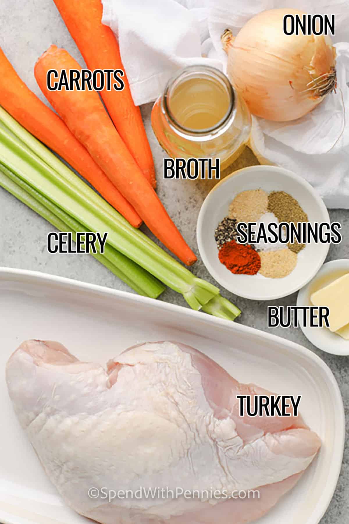 ingredients for Crockpot Turkey Breast including carrots, celery, onion, broth, seasonings, butter, and turkey