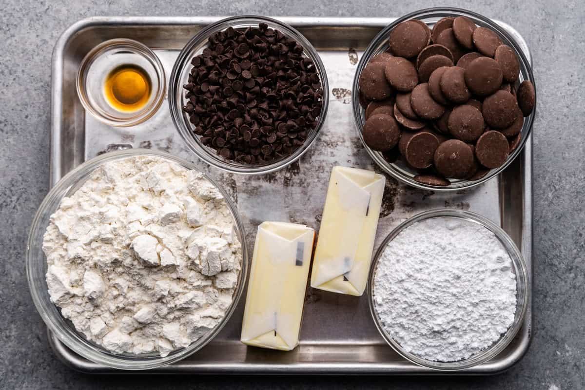 raw ingredients to make chocolate chip shortbread cookies on a baking sheet