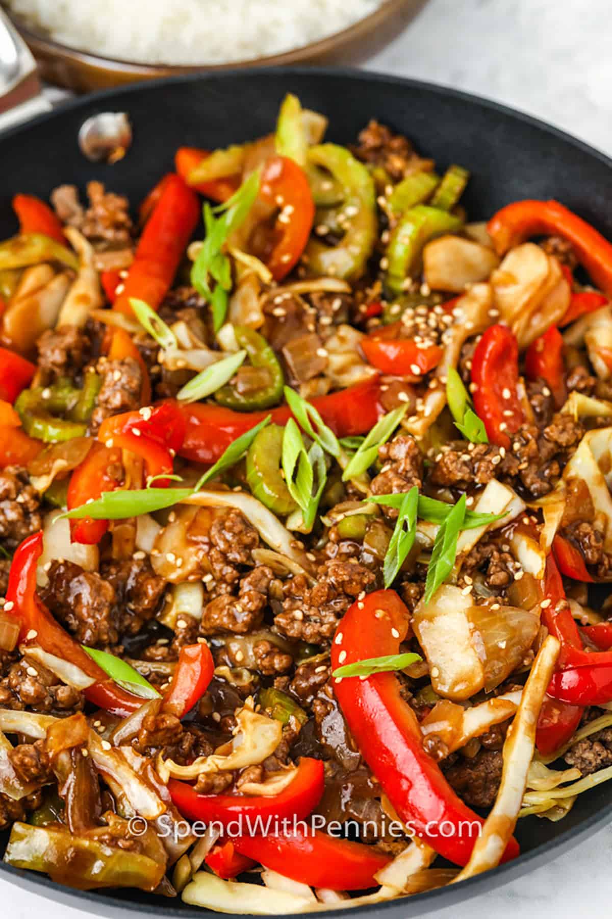 close up of pan of Sesame Ground Beef Stir Fry with sauce