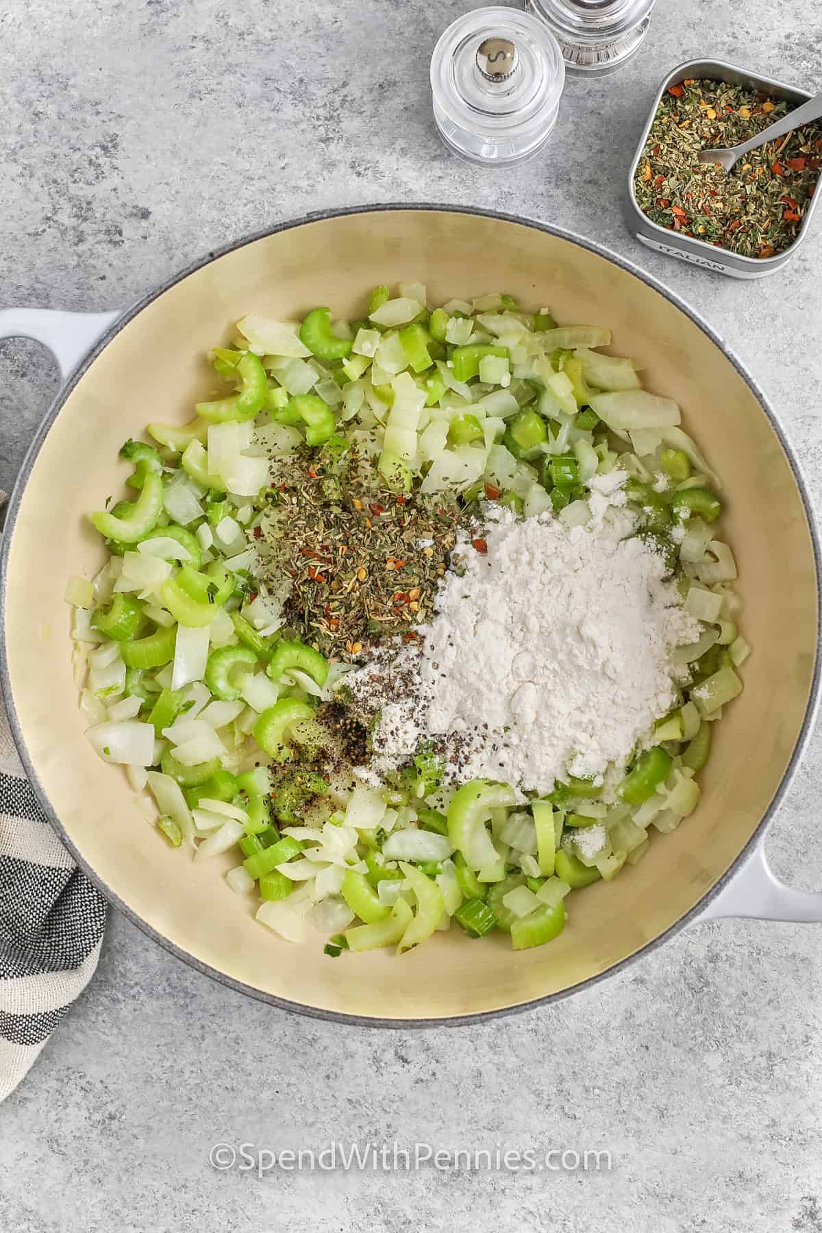 adding flour and seasonings to celery and onions mix to make Turkey Vegetable Soup