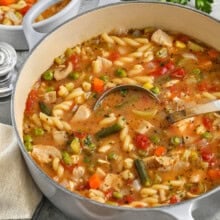 Turkey Vegetable Soup in the pot with a spoon