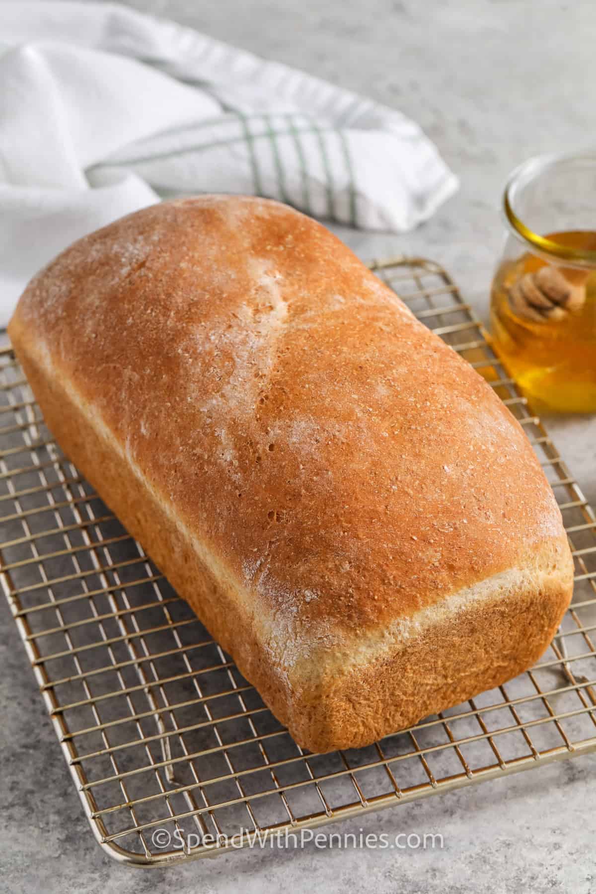 Whole Wheat Bread loaf on a metal rack