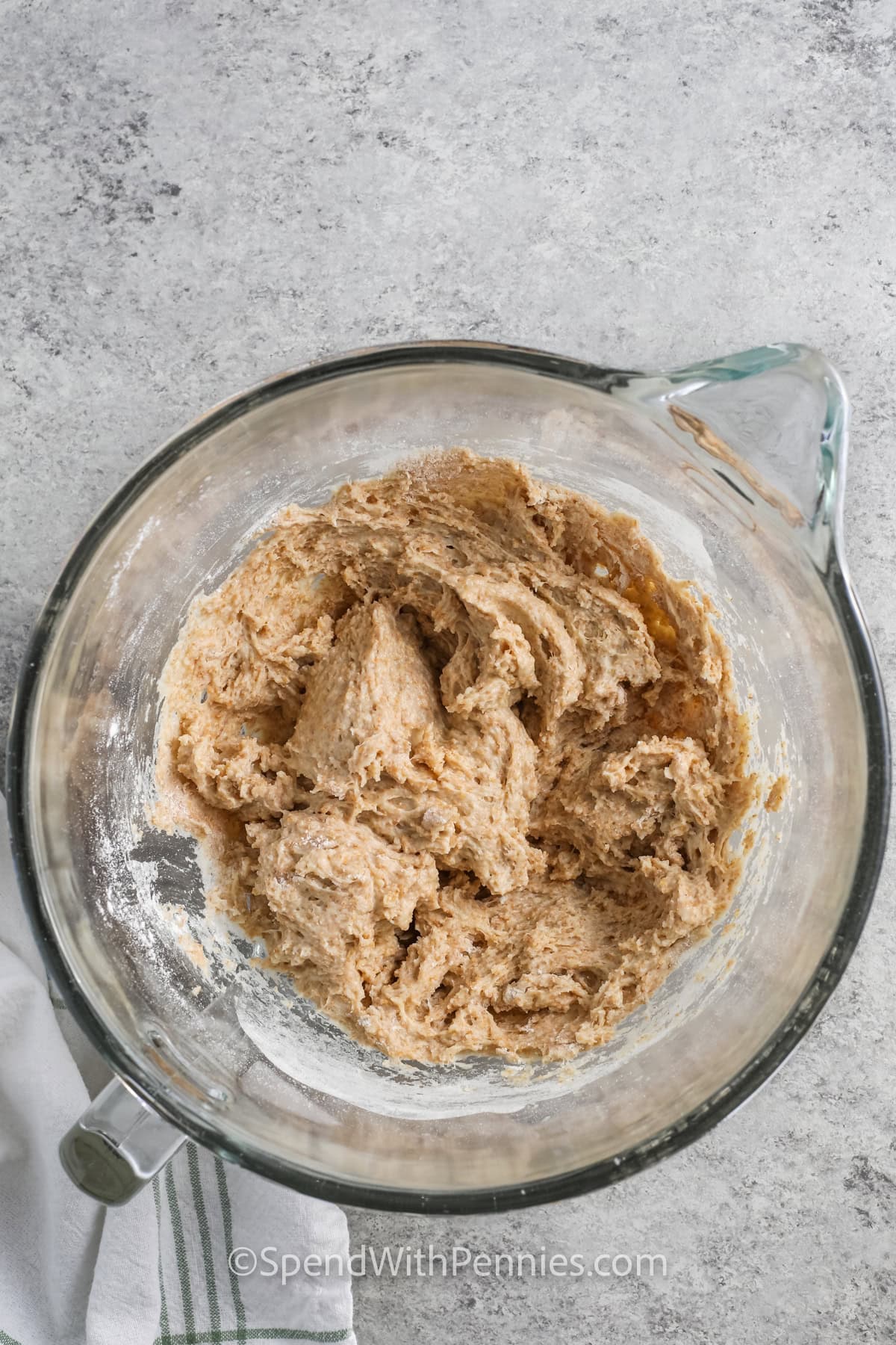 adding flour to yeast to make Whole Wheat Bread