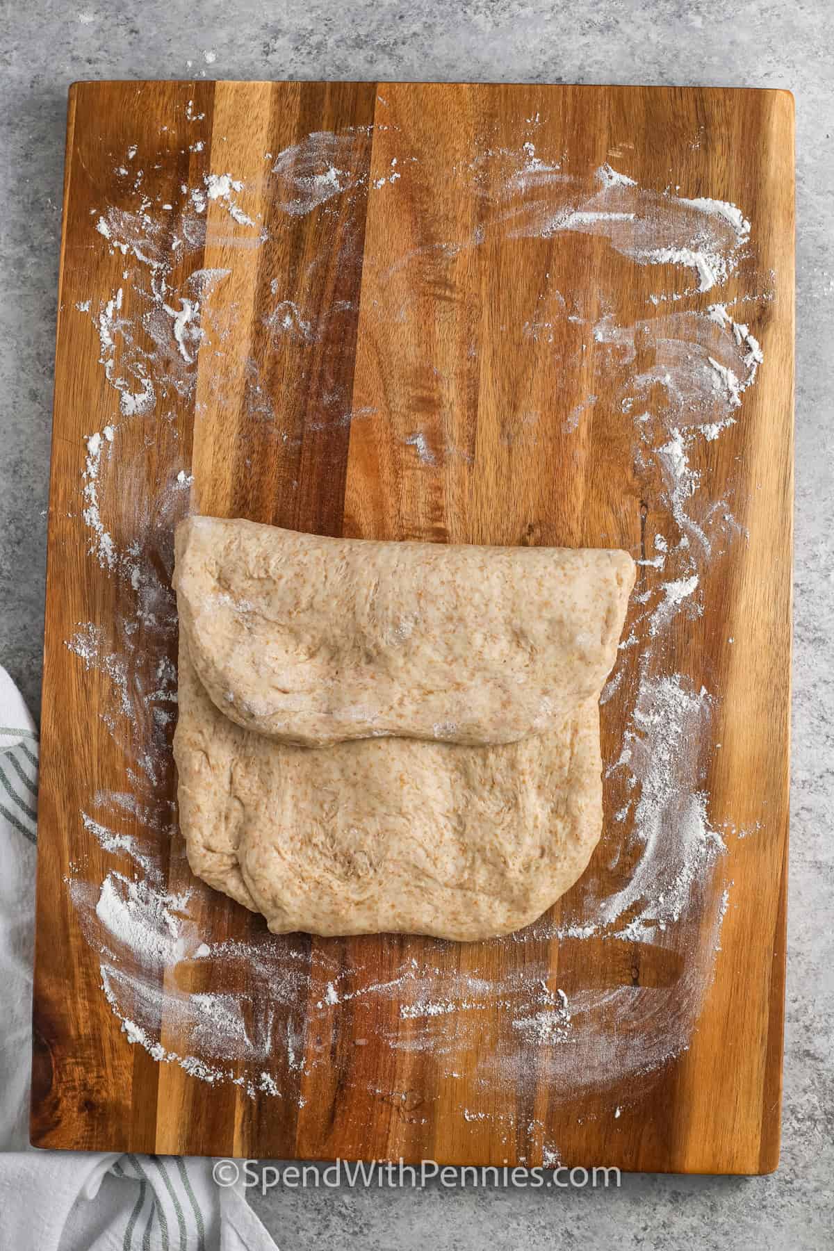 folding dough to make Whole Wheat Bread