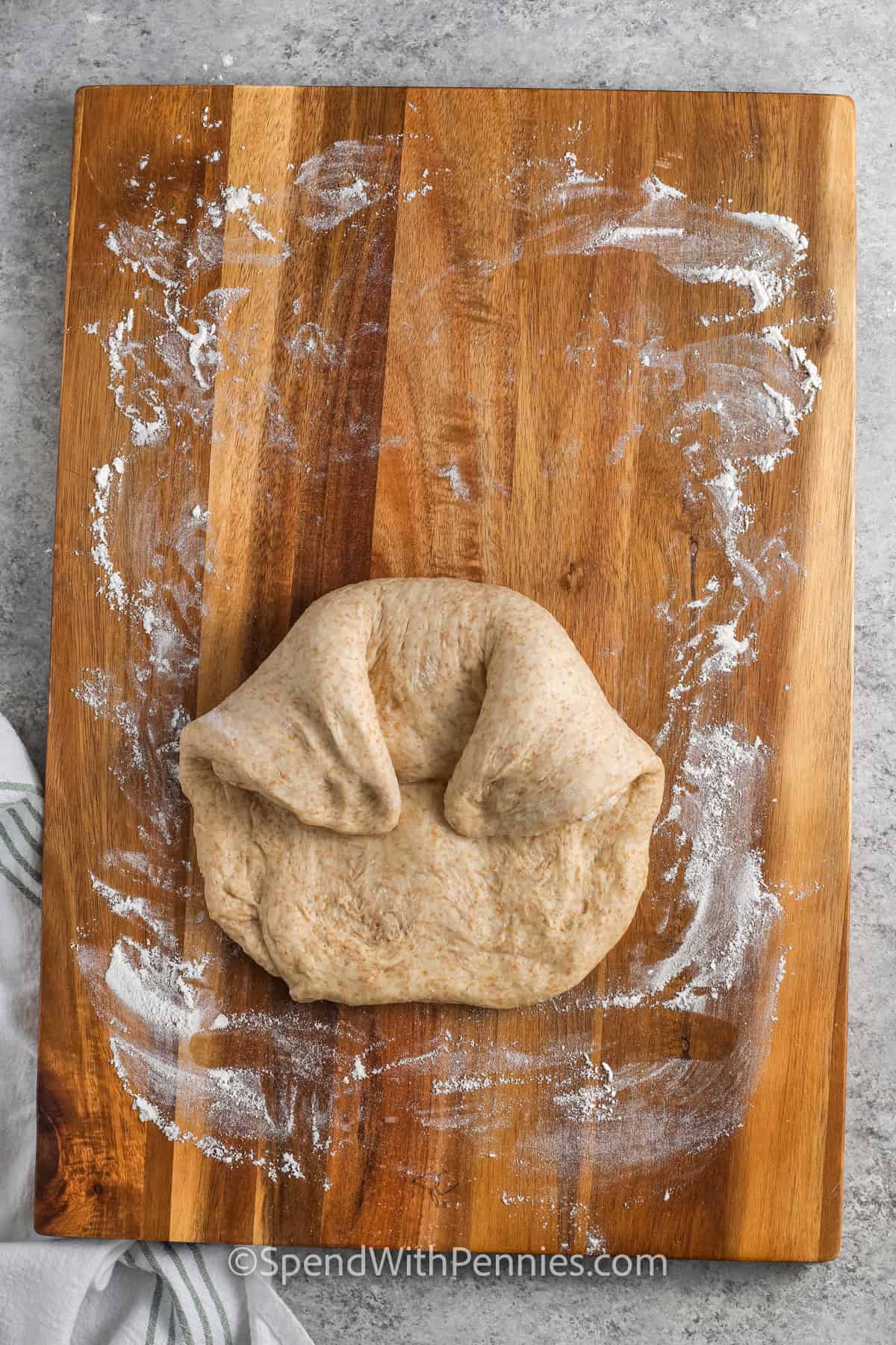 folding Whole Wheat Bread dough to make a loaf