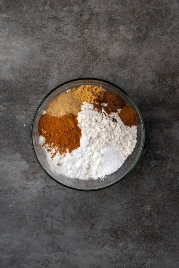 Dry ingredients combined in a glass bowl.