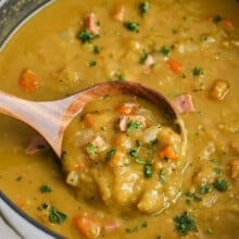 a pot of Split Pea Soup with a wooden spoon