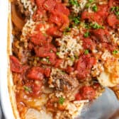 Hamburger potato casserole being served.