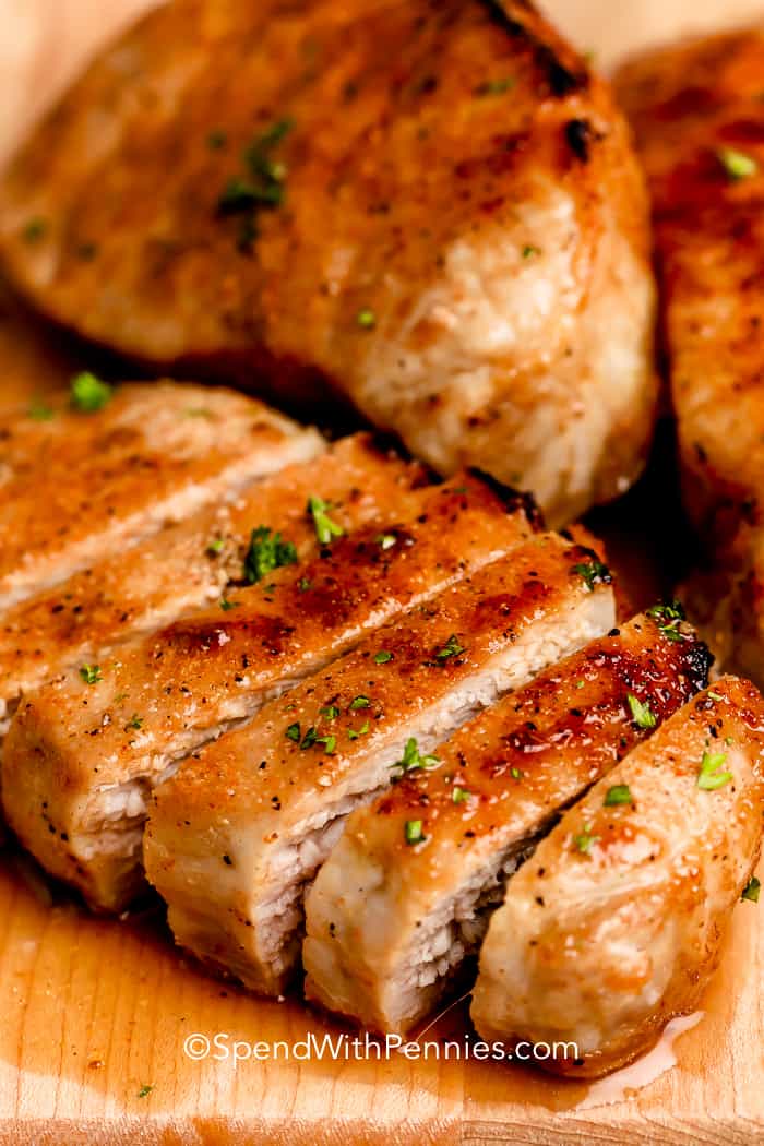 A baked pork chop sliced into strips