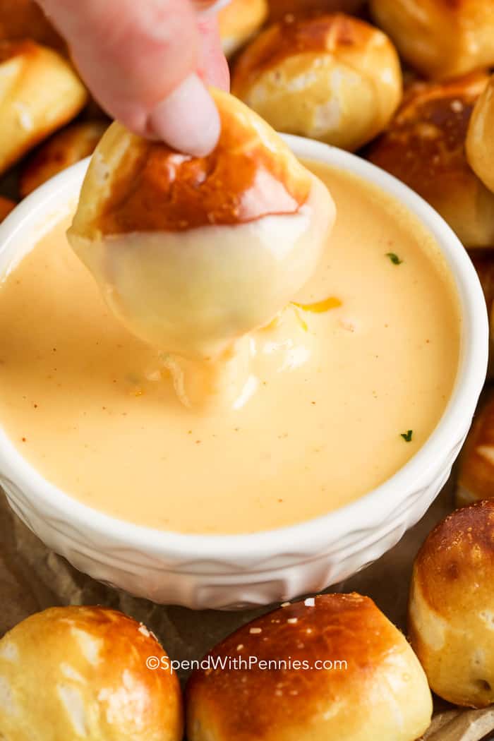 Pretzel bite dipped into a Beer Cheese Dip