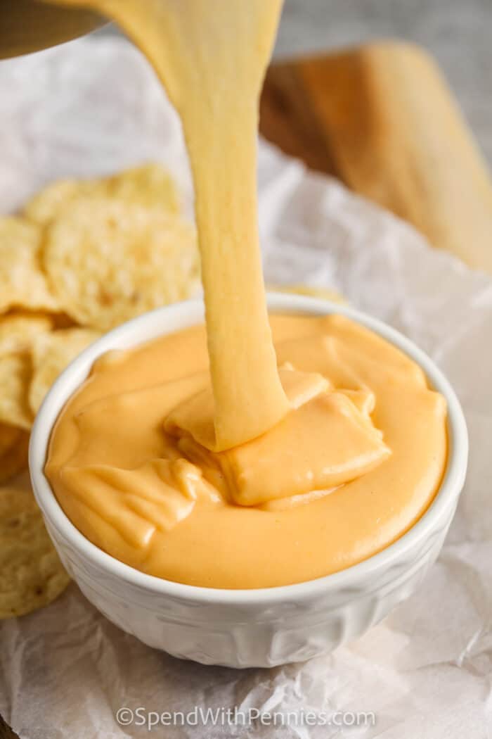 Beer Cheese Dip poured in a bowl with chips