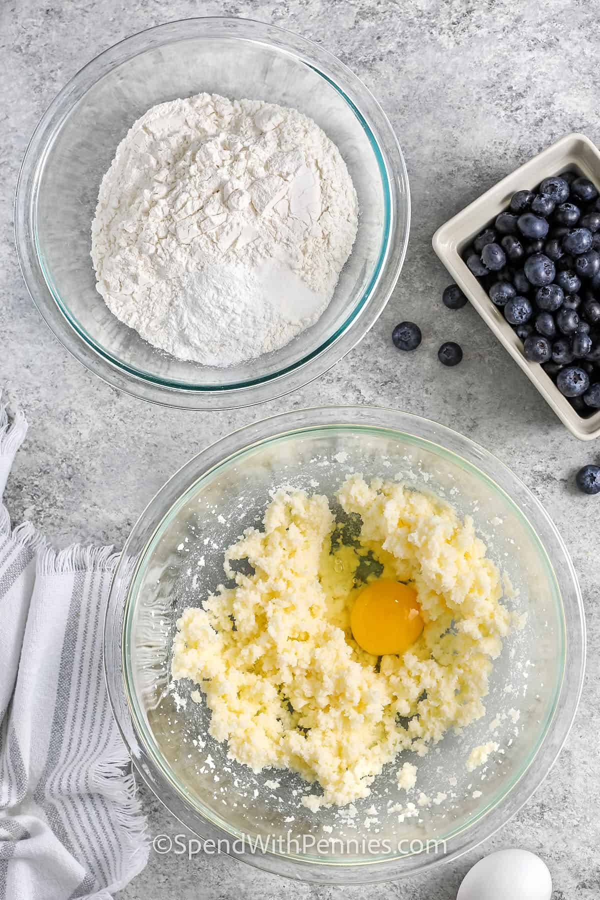 adding egg to sugar and butter mixture to make Blueberry Muffins