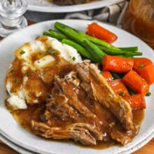 plated Crock Pot Pork Roast with mashed potatoes