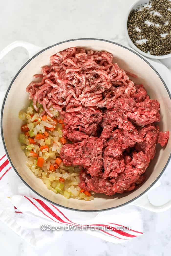 adding beef to onions to make Homemade Bolognese Sauce