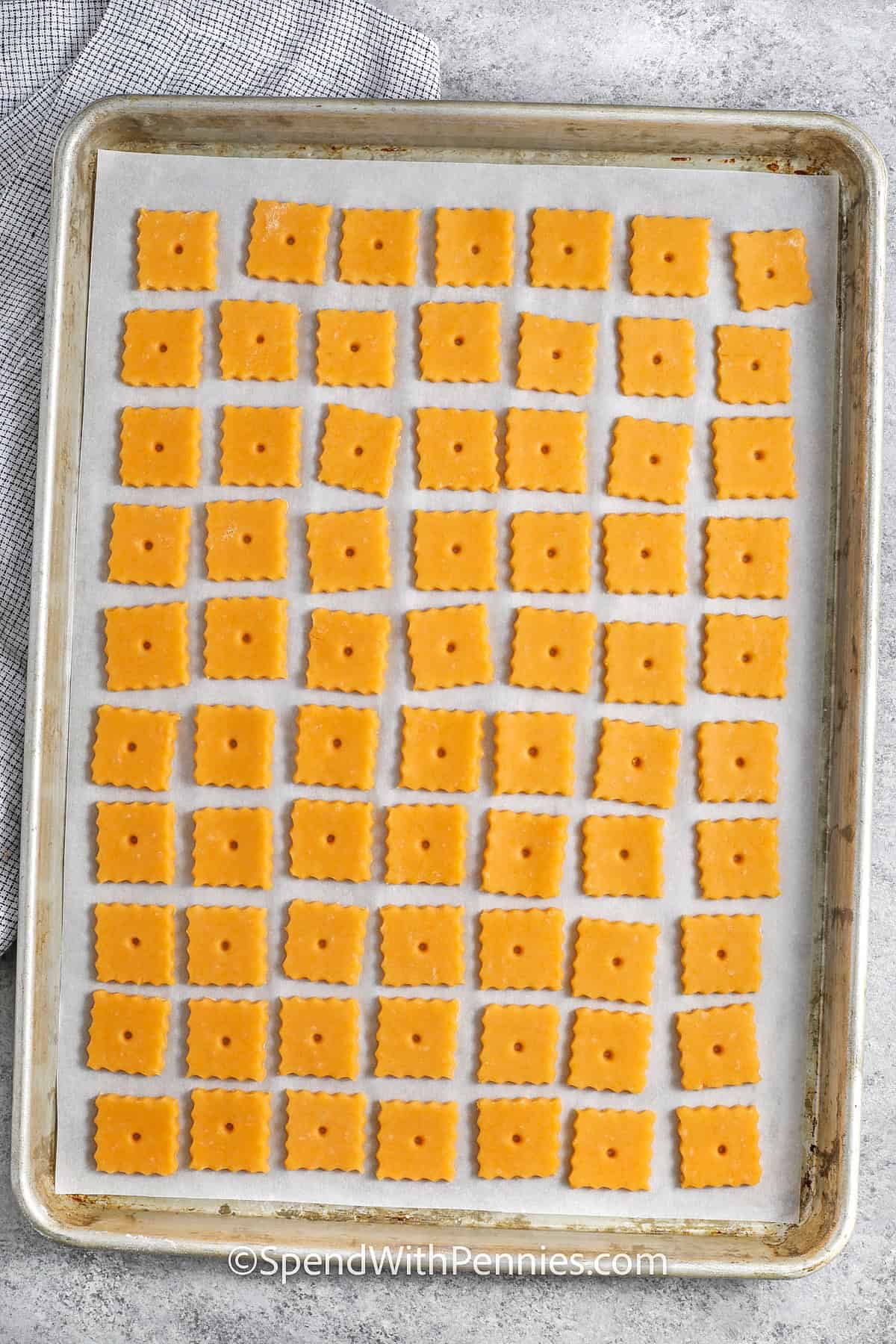 Homemade Cheez-Its on a sheet pan before cooking